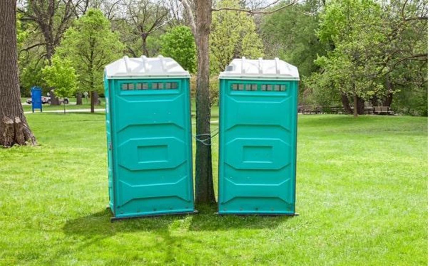 Row of portable restrooms set up for a corporate event